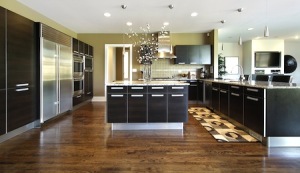 Kitchen in luxury home with dark cabinetry