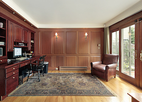 Library and office in luxury home with cherry wood paneling