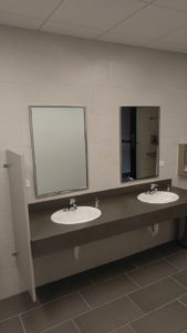 newly-remodeled-grey-bathroom-with-double-sinks